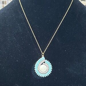 Elegant Gold and Blue Pendant Necklace. Faux turquoise and diamond with cream